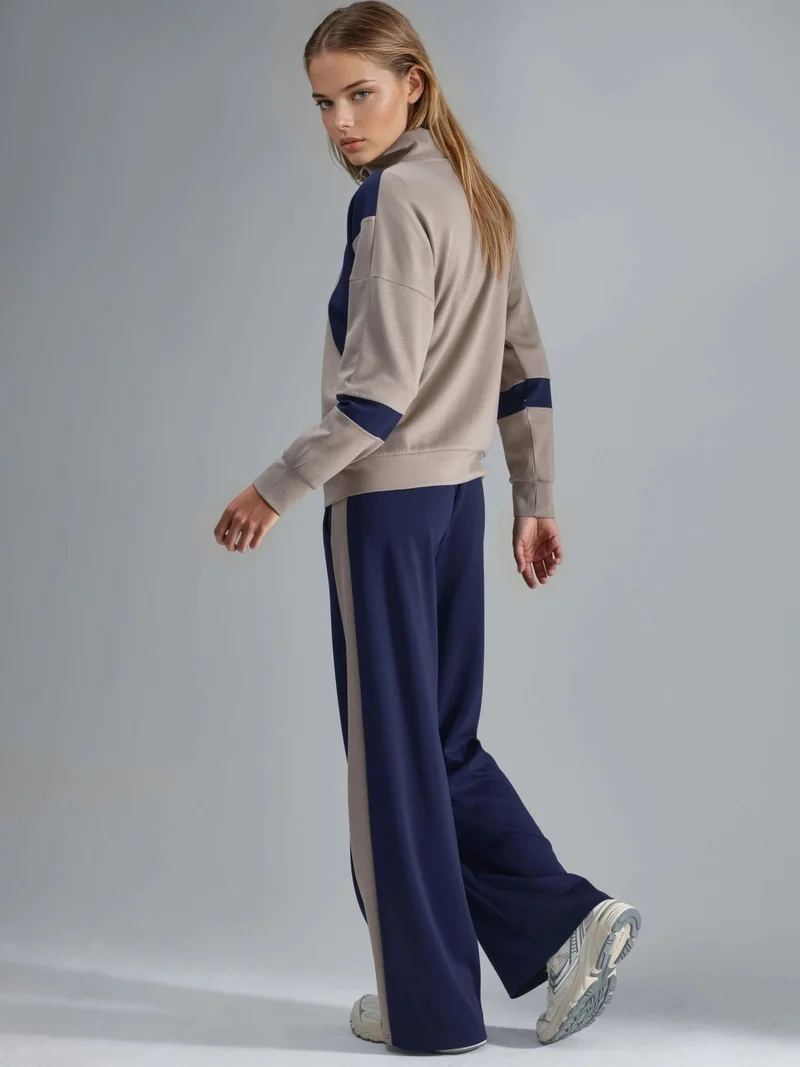 هيكاب طقم قطعتين واسع الساق بياقة بسحاب ولون متباين من مجموعة بيرسان